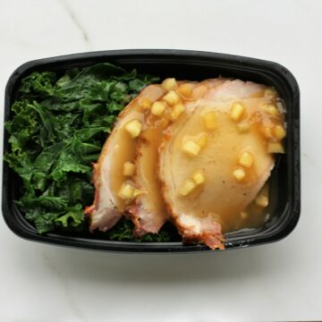 Tropical rum glazed pork loin with sautéed kale and carrot