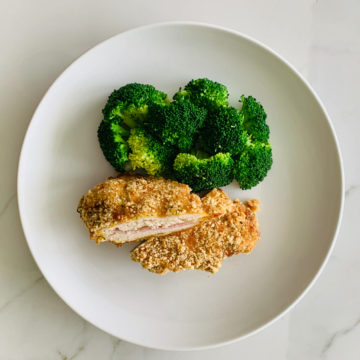 Chicken cordon bleu served with broccoli