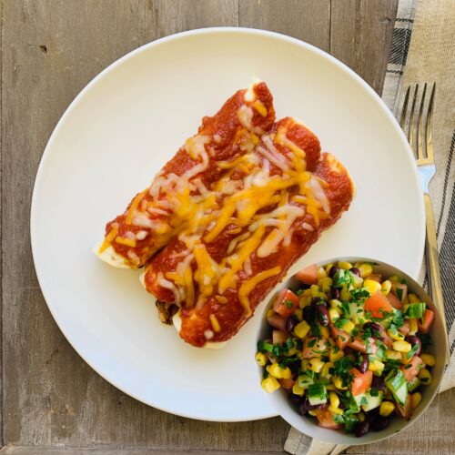 Chicken enchiladas with black bean corn salad