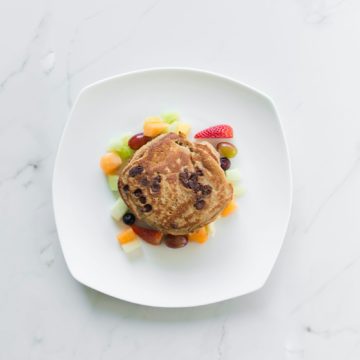 Banana chocolate protein pancakes and fruit