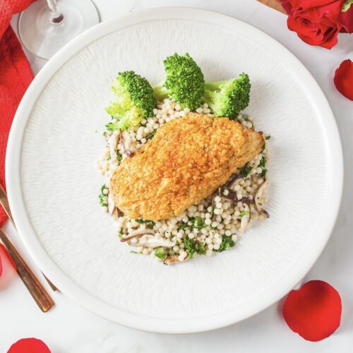 Hummus crusted chicken with Israeli couscous